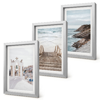 Conjunto de molduras com imagens Vistas do mar e da arquitetura de Santorini contra o céu.
