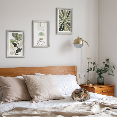 Conjunto de 3 quadros decorativos Motivos vegetais com formas geométricas em verde.