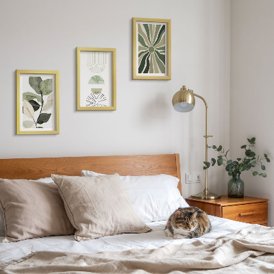 Conjunto de 3 quadros decorativos Motivos vegetais com formas geométricas em verde.