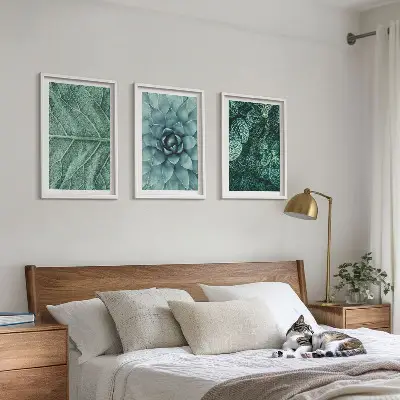 Conjunto de quadros para sala de estar com detalhe de folhas de planta