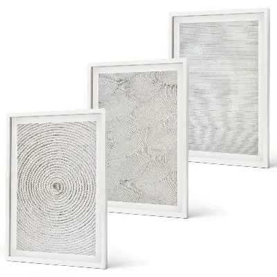 Composição de quadros moderna com padrões geométricos em papelão