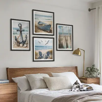 Composição de quadros com tema de âncora barco e remos na praia